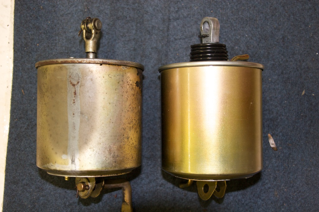 original and replacement actuator from a 68 Camaro RS