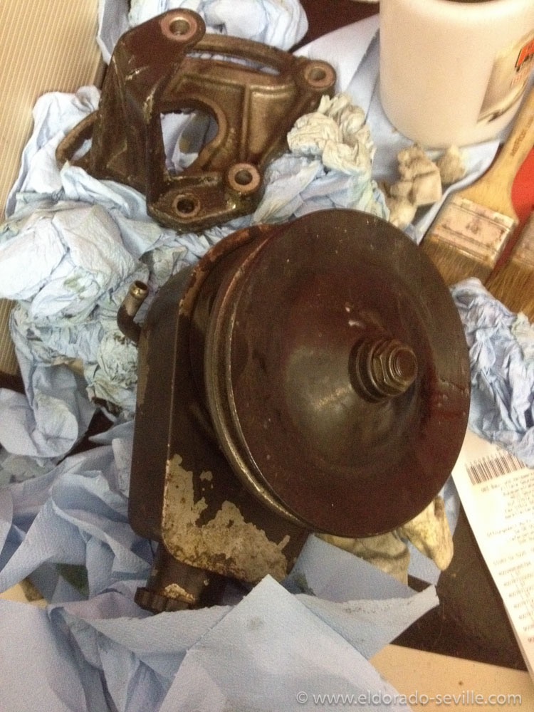 The power steering pump before cleaning