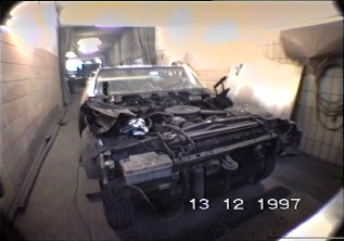 A walk through the restoration shop  - see the disassembled car. Filmed in 1997