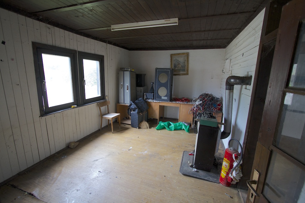 cleaning up the inside of the wooden building