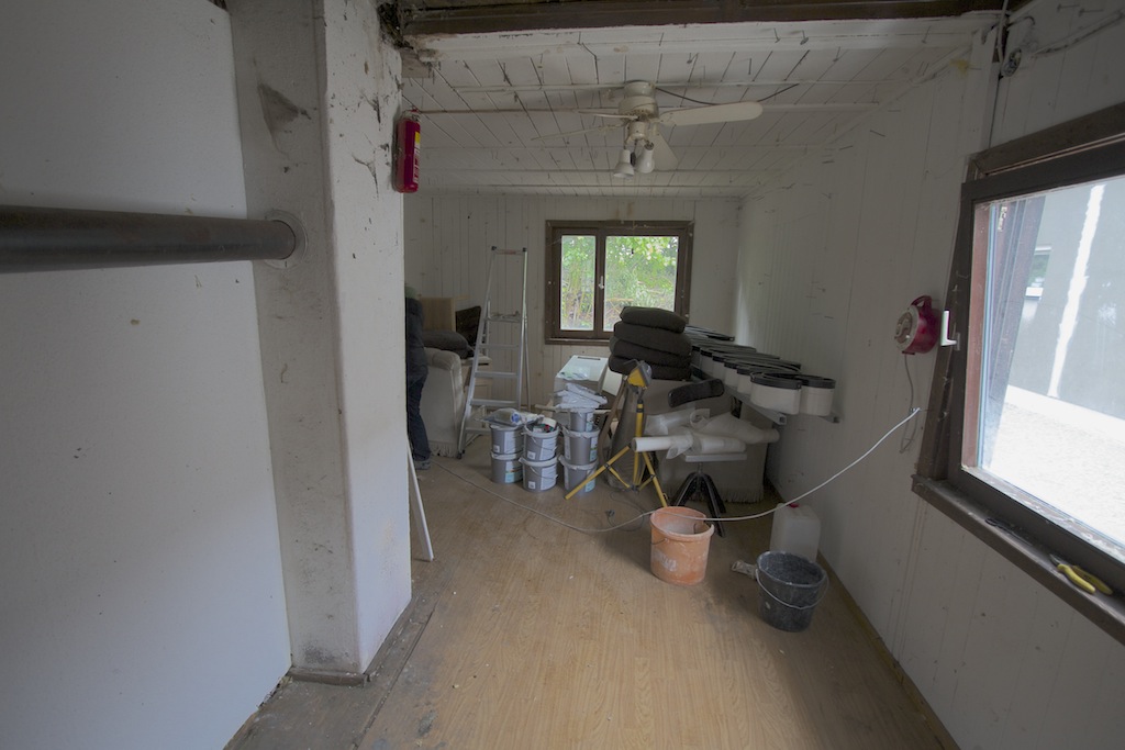 cleaning up the inside of the wooden building