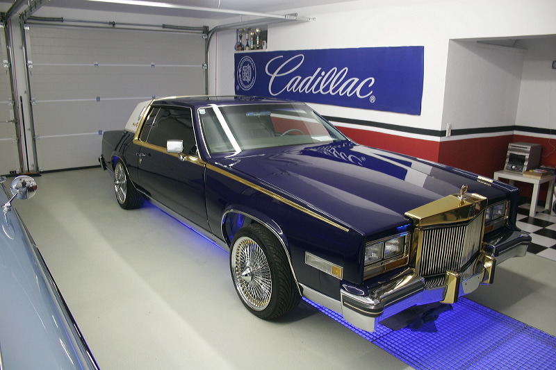 Cadillacs in garage